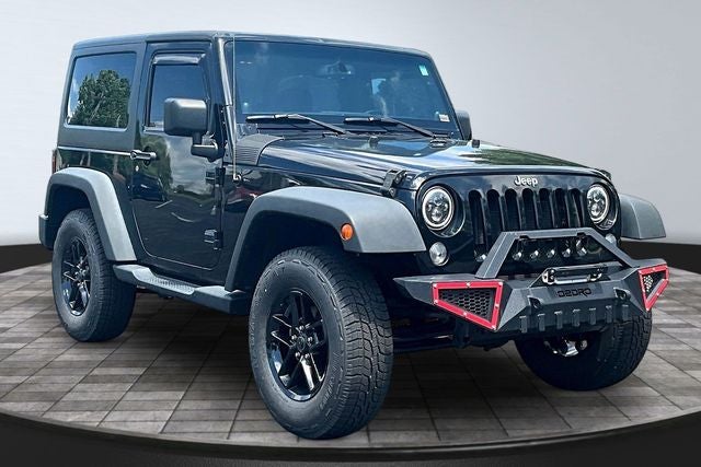 2014 Jeep Wrangler — rear three-quarter view