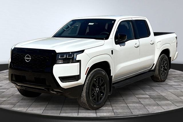 2026 Nissan Frontier SV in Glacier White — front three-quarter view
