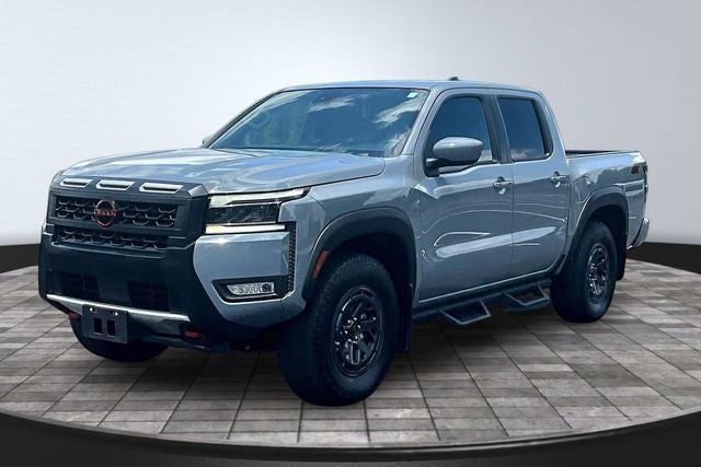 2025 Nissan Frontier PRO-4X in Boulder Gray Pearl — front three-quarter view