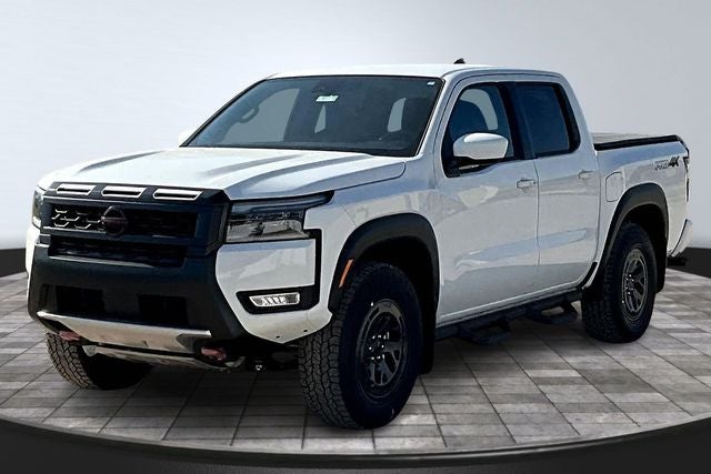 2026 Nissan Frontier PRO-4X in Glacier White — front three-quarter view