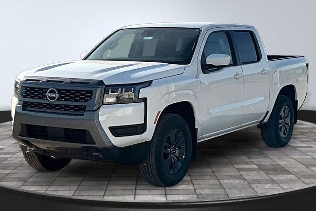 2026 Nissan Frontier SV in Glacier White — front three-quarter view