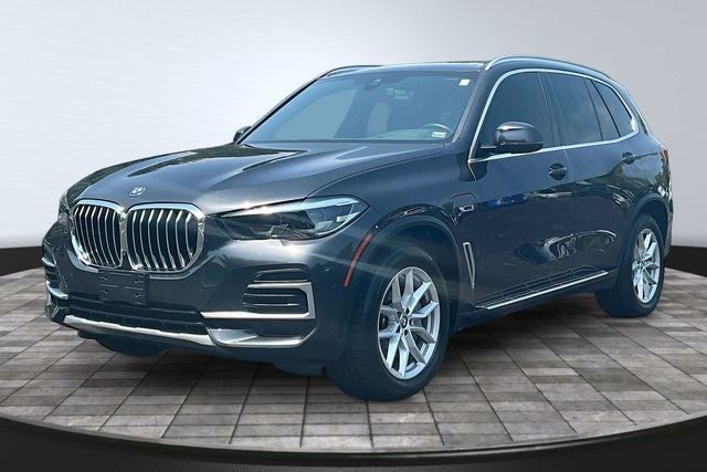 2023 BMW X5 xDrive45e in Dark Graphite Metallic — front three-quarter view