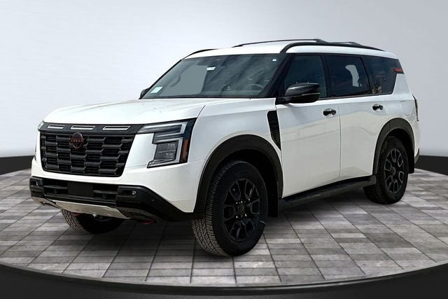 2026 Nissan Armada PRO-4X in Aspen White Tricoat — front three-quarter view