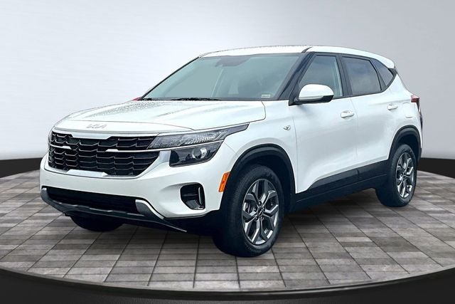 2024 Kia Seltos LX in Snow White Pearl — front three-quarter view
